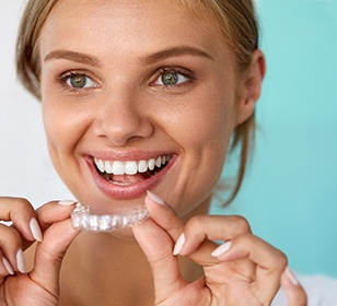 patient smiling while teeth whitening