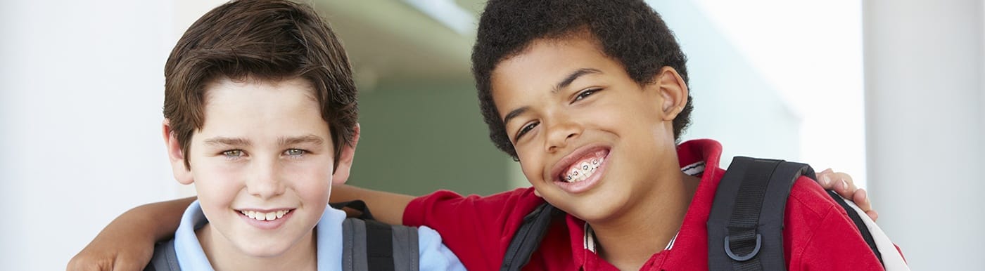 Two young boys with healthy smiles thanks to children's dentistry