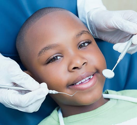 Young boy receiving dental checkup