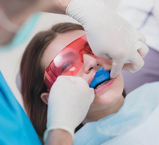 Child receiving fluoride treatment