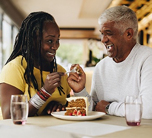 Senior couple enjoying slice of pie together