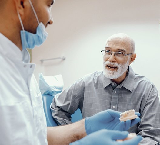 man asking his denture dentist in Doylestown about dentures