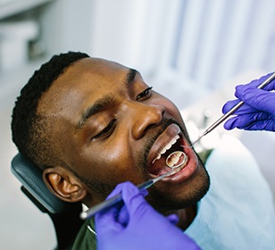 man with dental implants in Doylestown getting dental checkup 