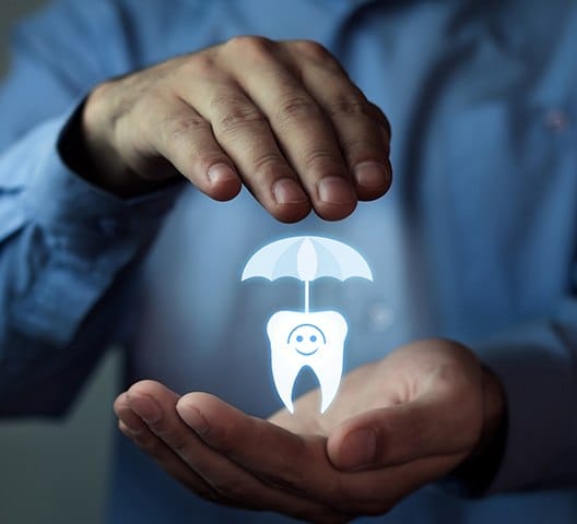 Hand holding animated tooth under an umbrella