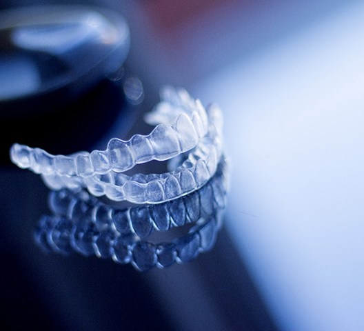 Invisalign aligners sitting on a counter