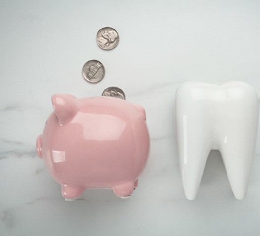 tooth and piggy bank for smile makeover in Doylestown  