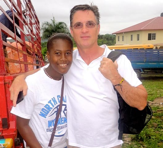 Doctor Rakowsky smiling with dental patient