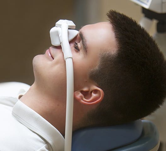 Patient with nitrous oxide nose mask