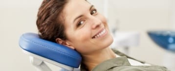 Woman at preventive dentistry checkup smiling