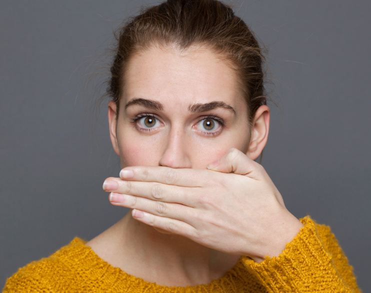 Woman covering mouth